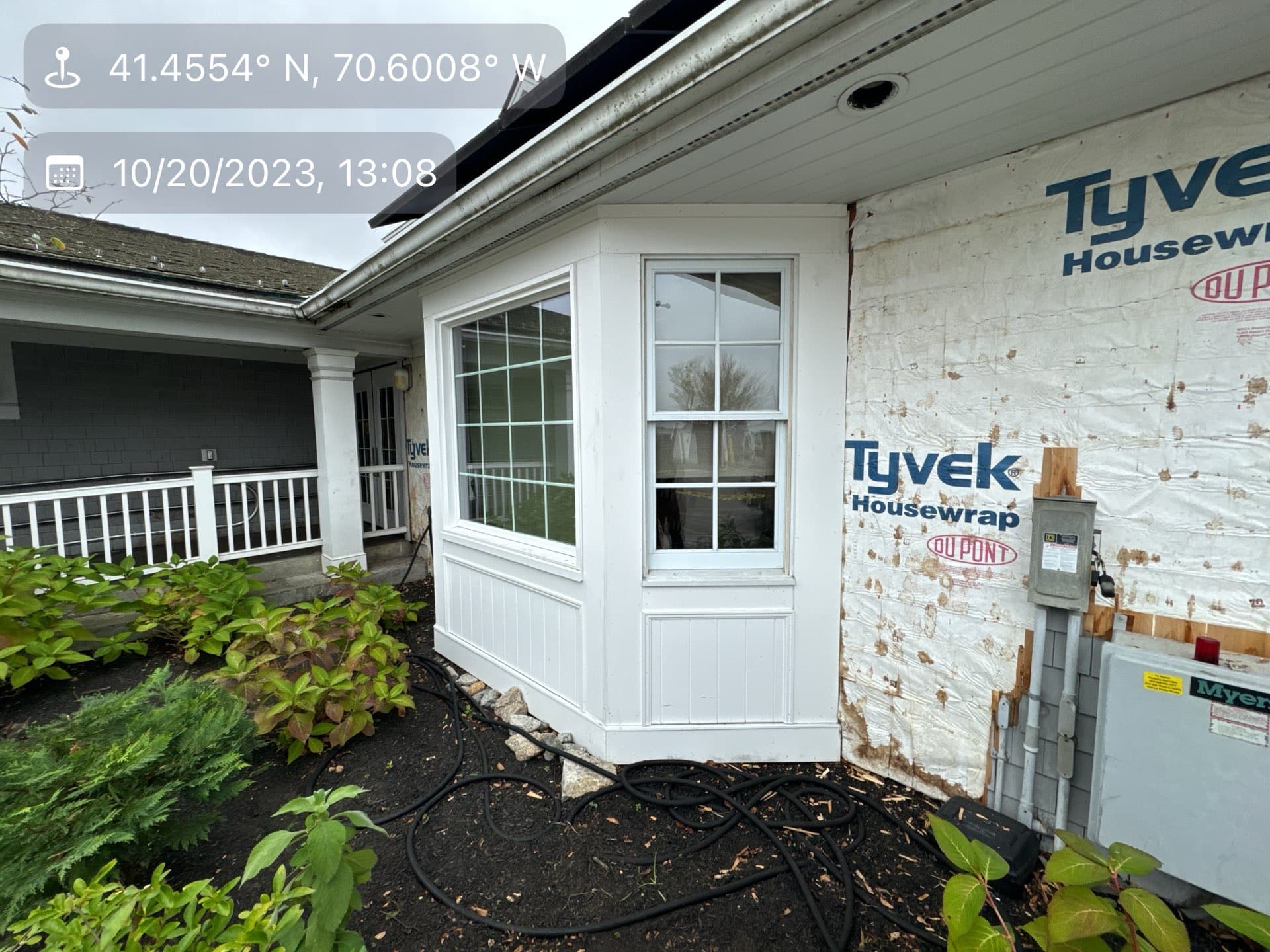 2023-10-20 17 08 40Z-lnyv7rtrc1tz7llh New white bay window against a wall covered in Tyvek house wrap.